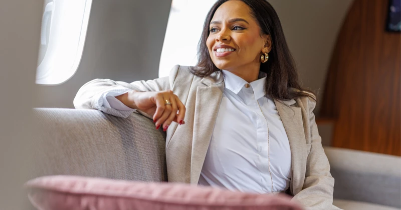 Image of a businesswoman looking out the window of an office