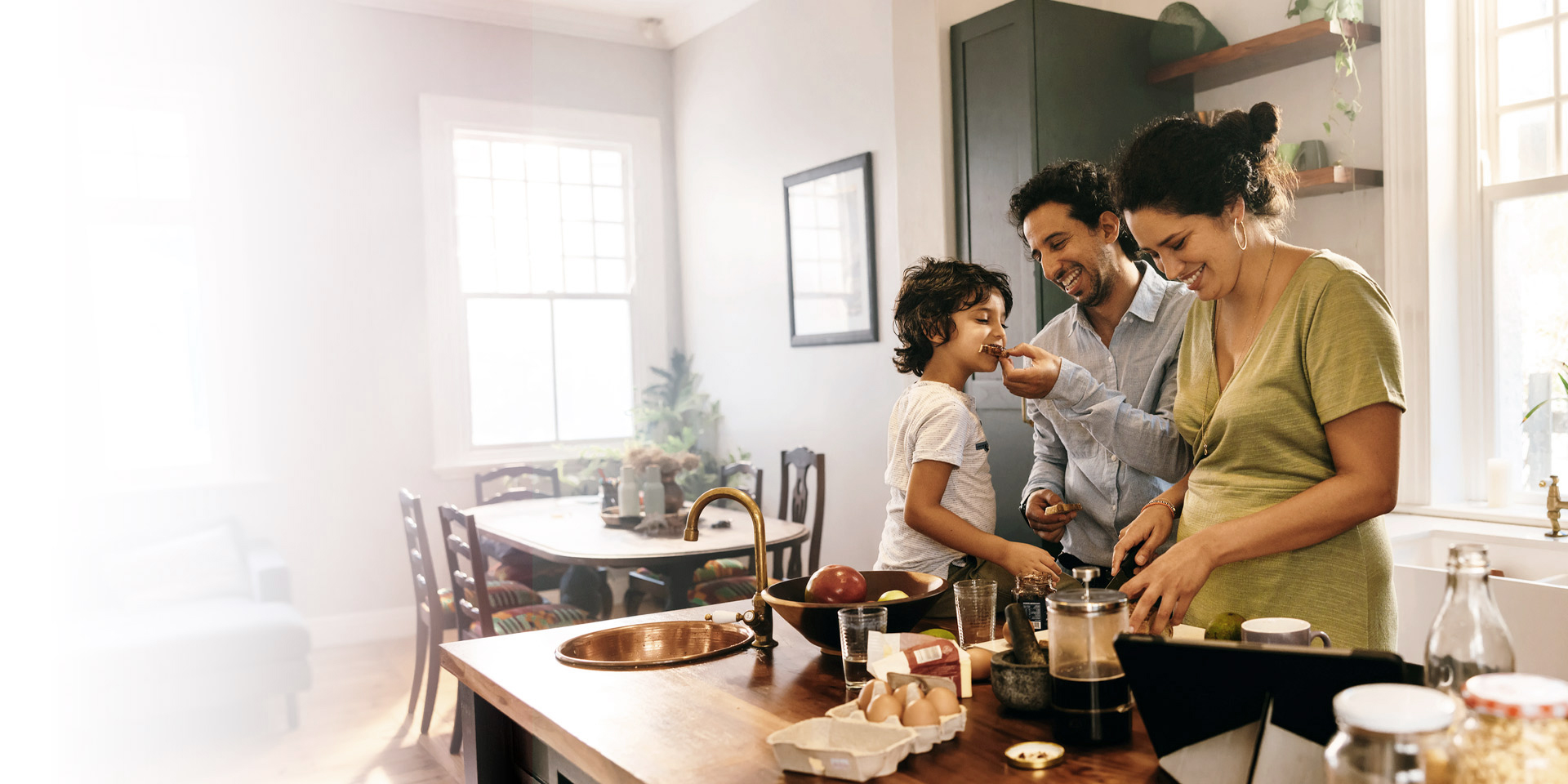 A family hanging out in their kitchen