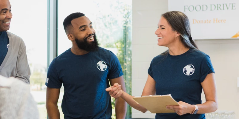Associates out speaking in the community at a Food Drive