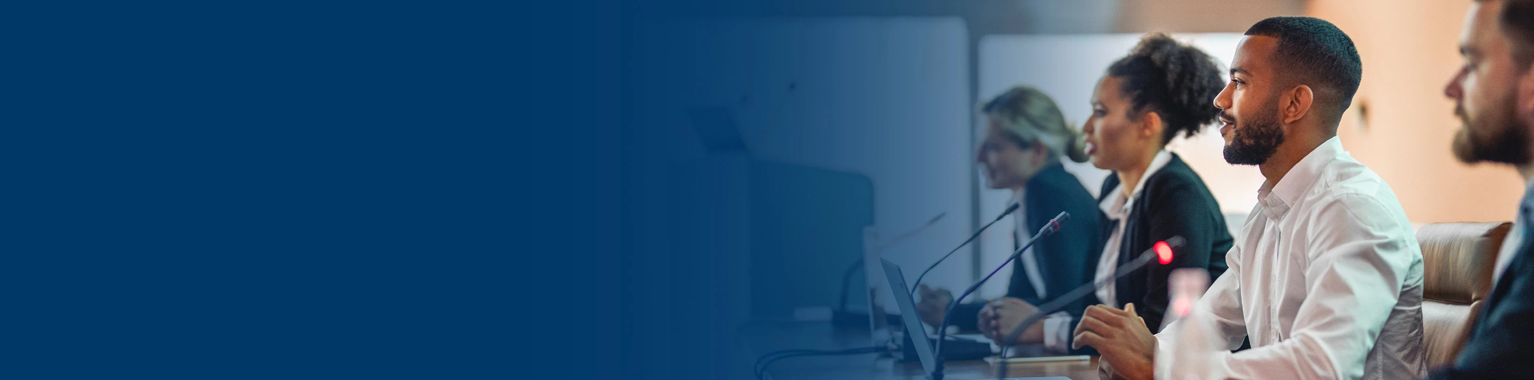 A group of colleagues presenting as a panel