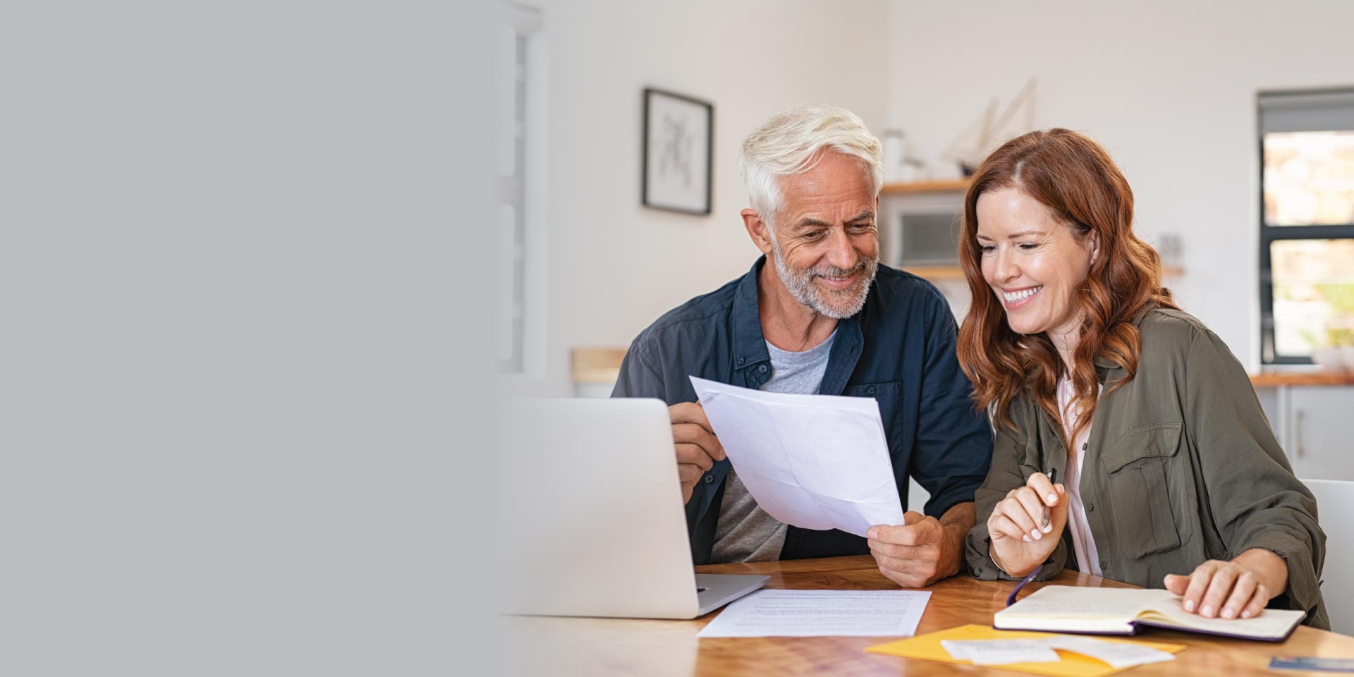 Husband and wife reviewing their financials