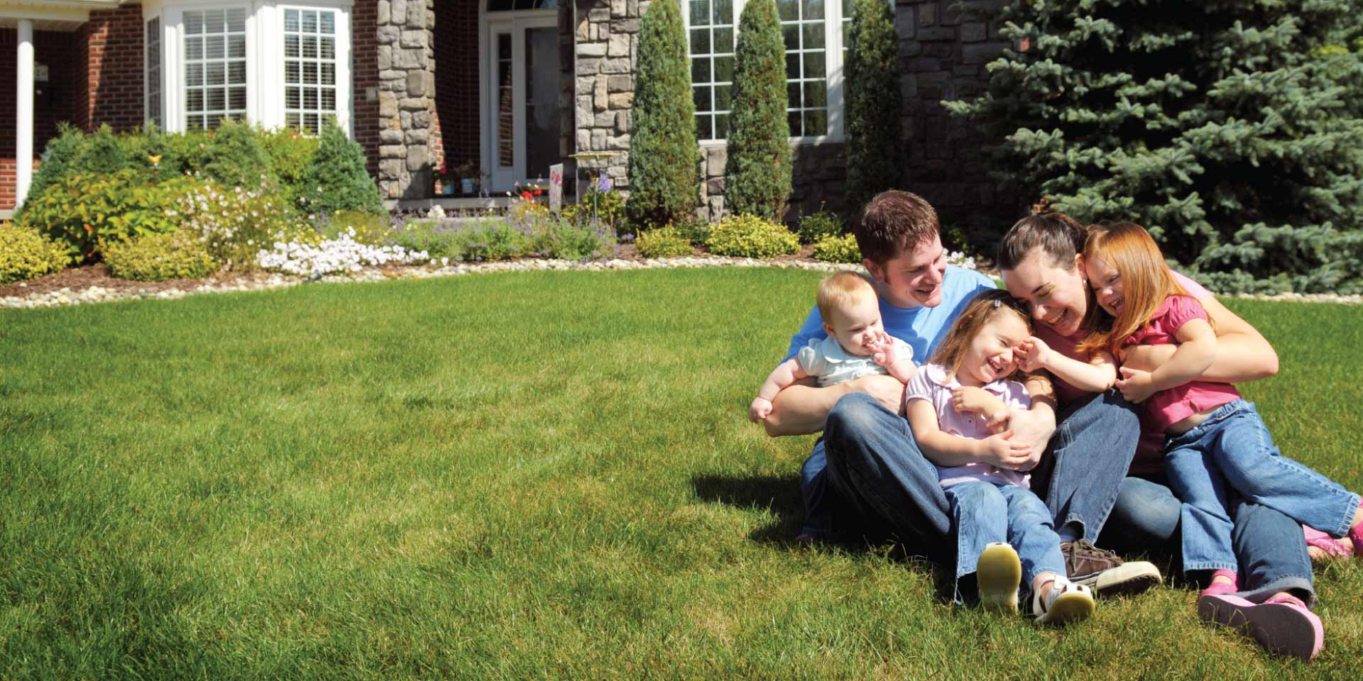  A family outside playing in the lawn