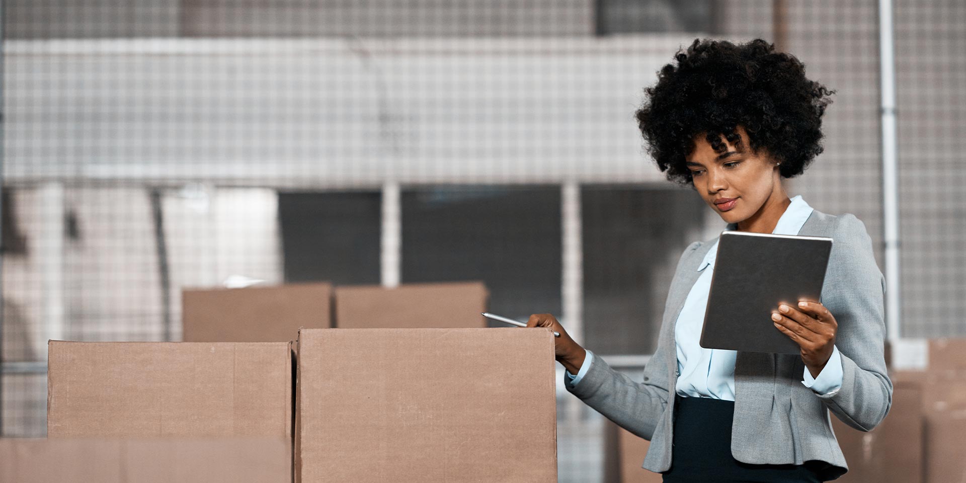 A businesswoman owns a company that opened a Business Money Market account and is using tablet to record her inventory