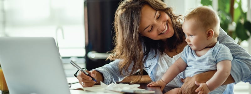 A mom and her child at her laptop