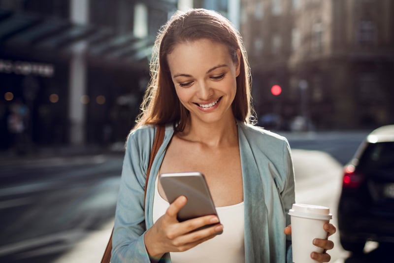 A woman signing up on her mobile device