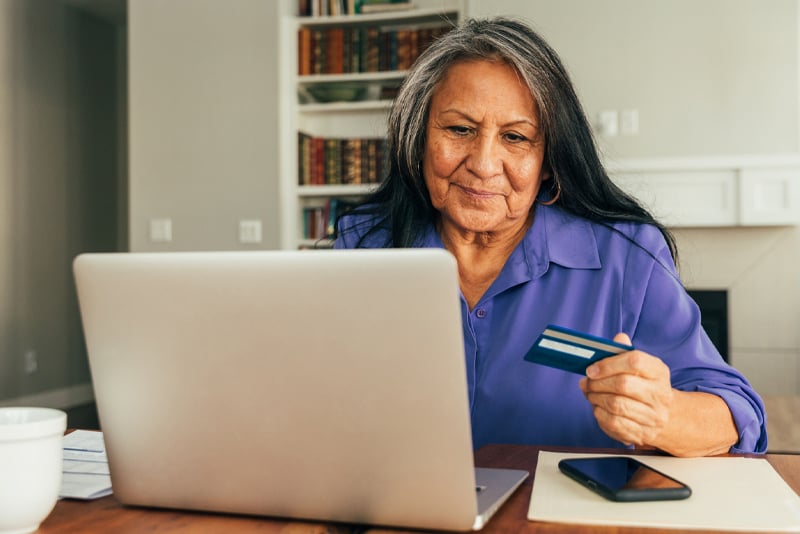 A woman paying a bill online
