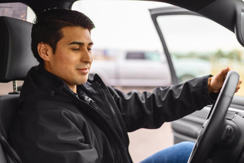 A man turning on his car