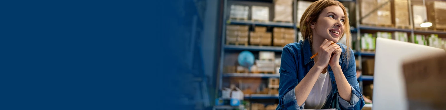 A woman working in her warehouse