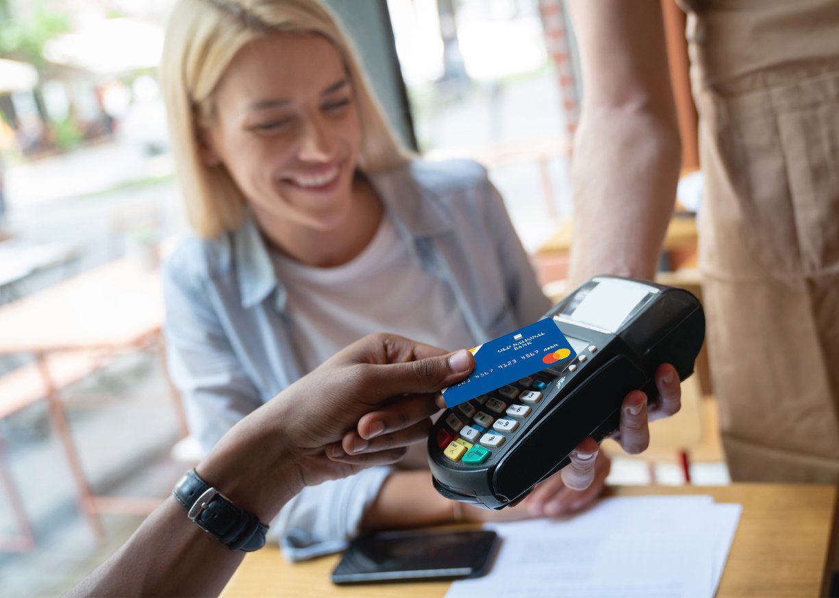 A woman paying the bill by her card