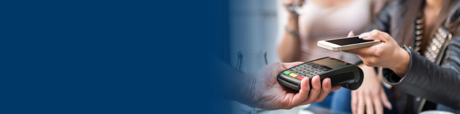 A woman paying with her mobile device