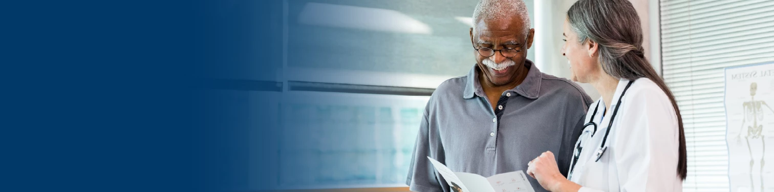 A man talking to his doctor about his records