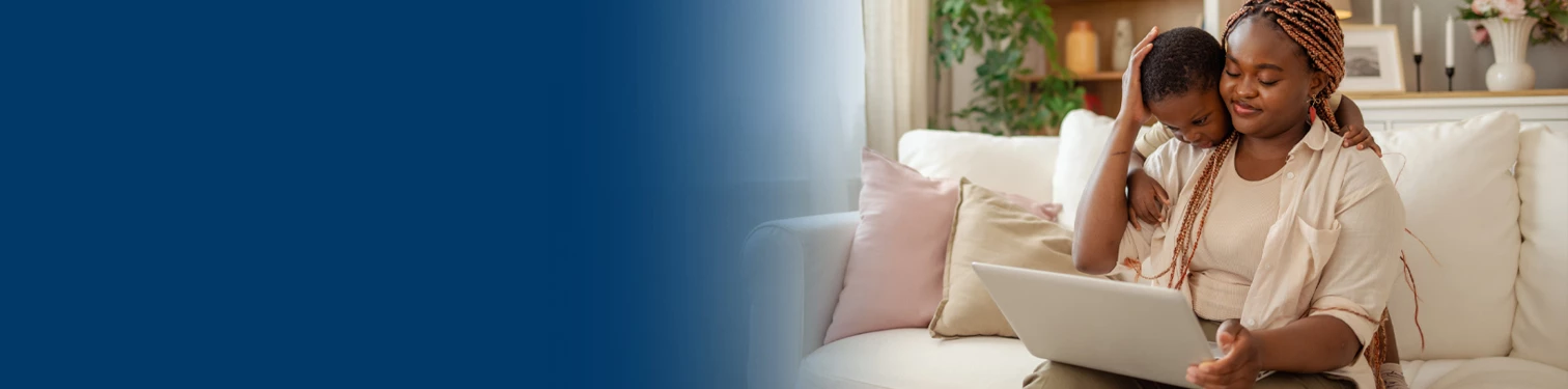 A woman on her sofa signing up for estatements