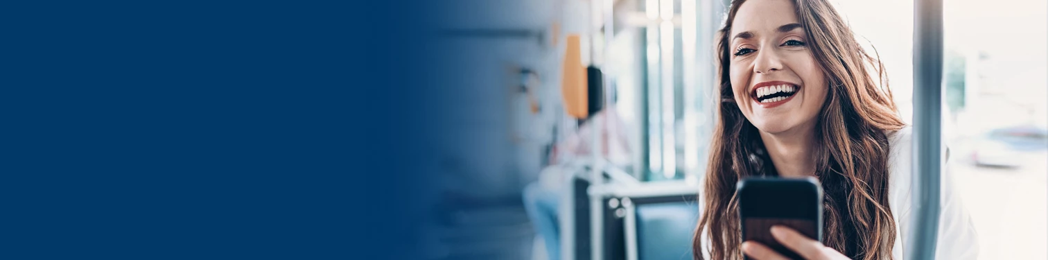 A woman on the bus using her mobile app