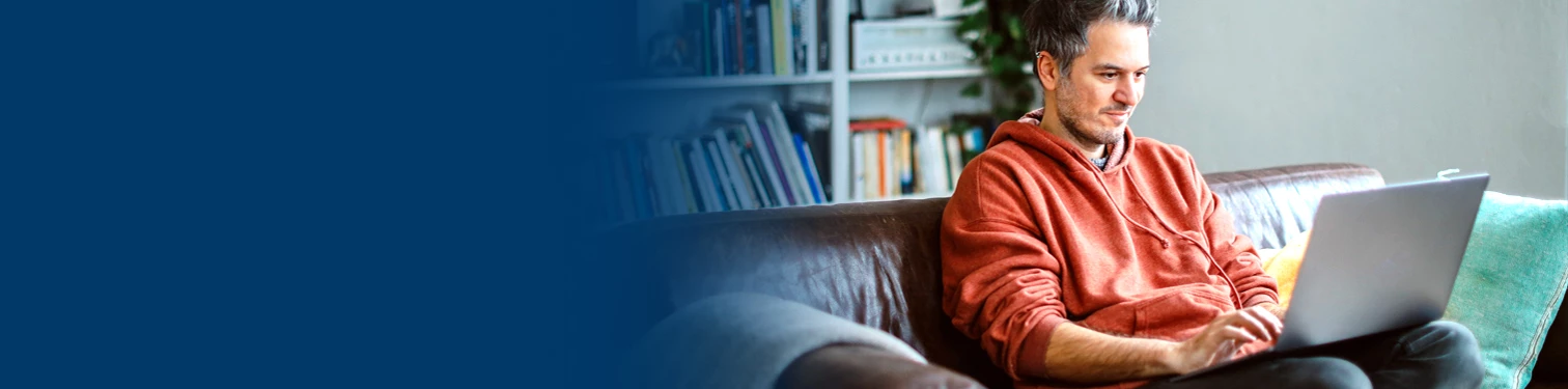 A man looking at his banking account online