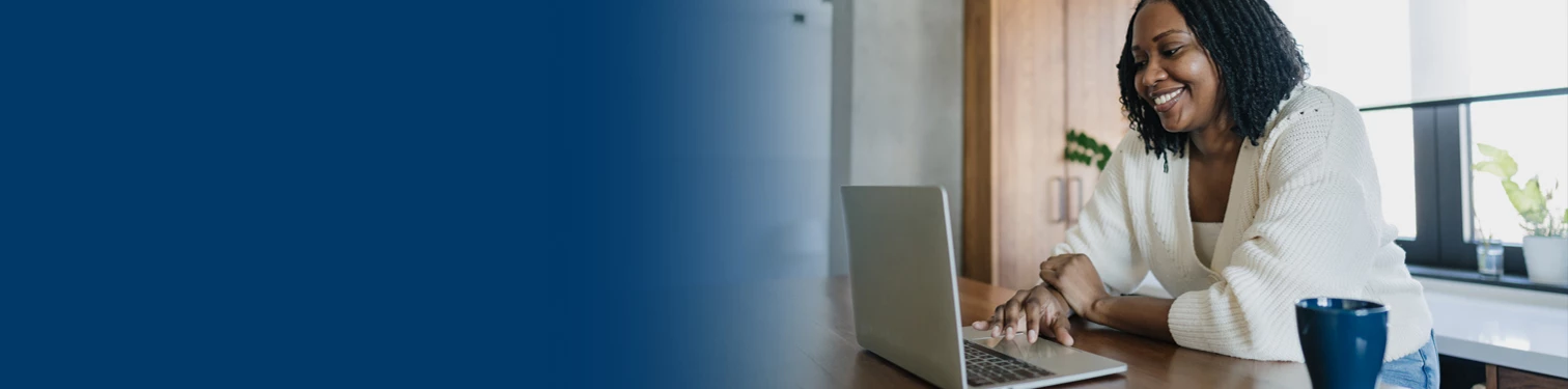 A woman utilizing the ONB Mortgage Manager on her laptop