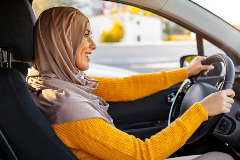 Profile image of a woman driving a car