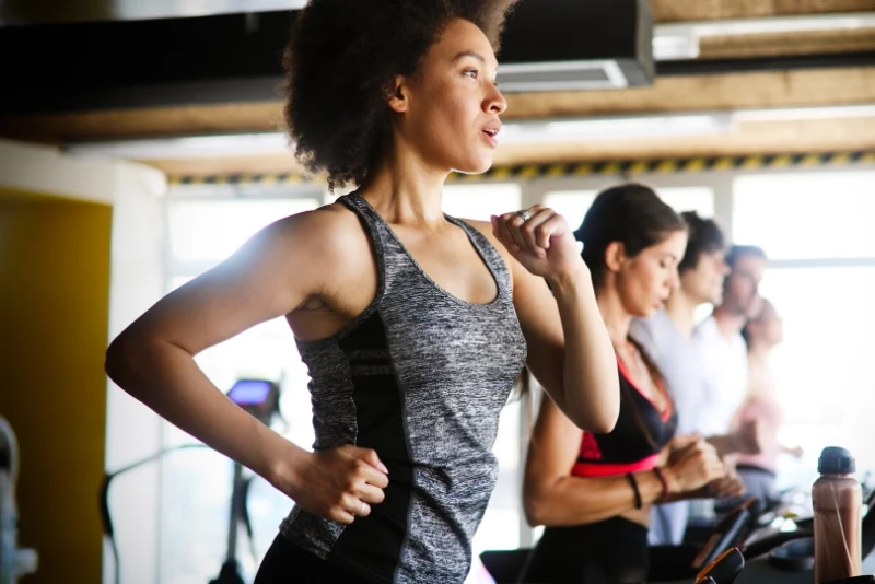 Image of a woman running on a treadmill