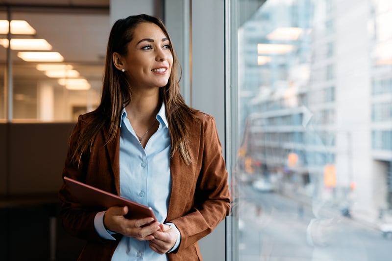 A woman looking outside the building