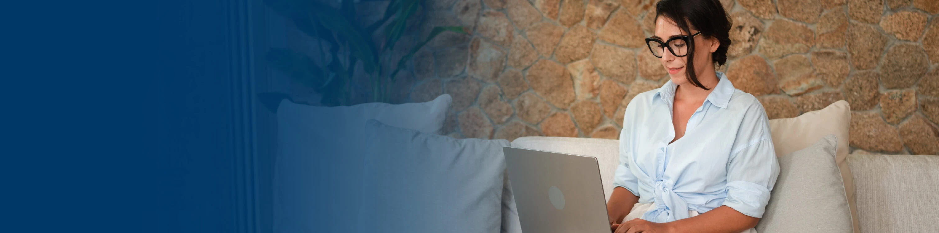 A woman at her laptop looking for wealth information