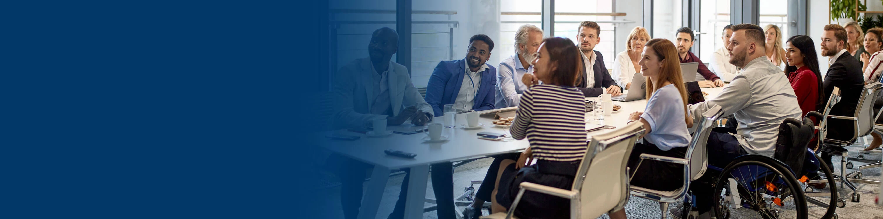 A group of people together having a meeting
