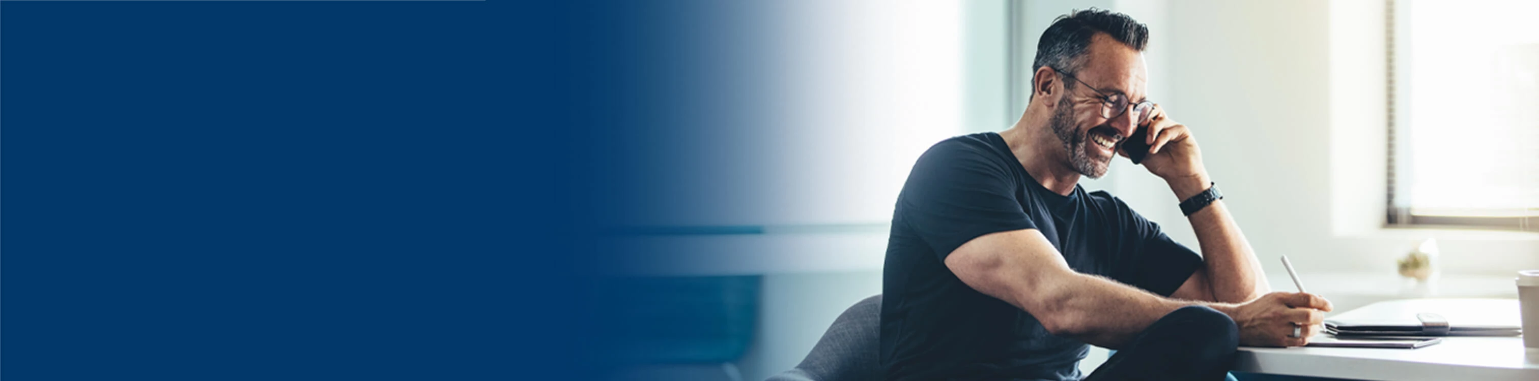 A man talking on his phone to client care
