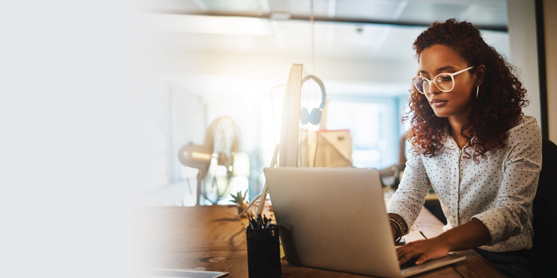 A woman researching topics about fraud on her laptop