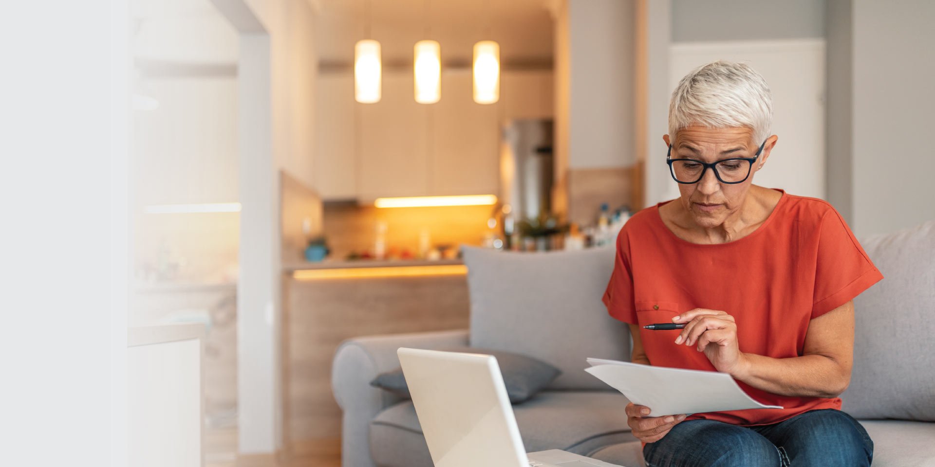 A woman looking at her statements for any fraud activity