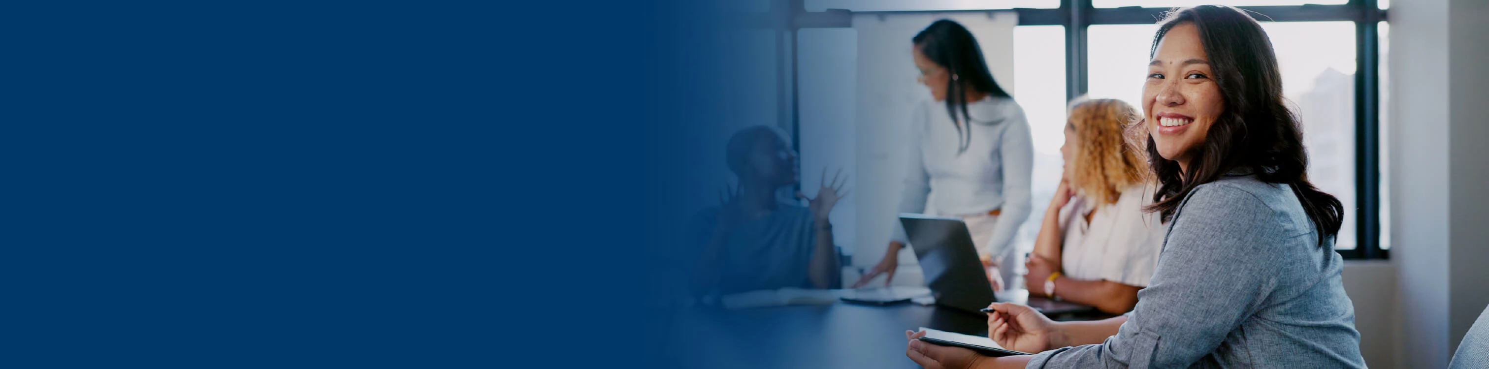 Associates huddled in a conference room