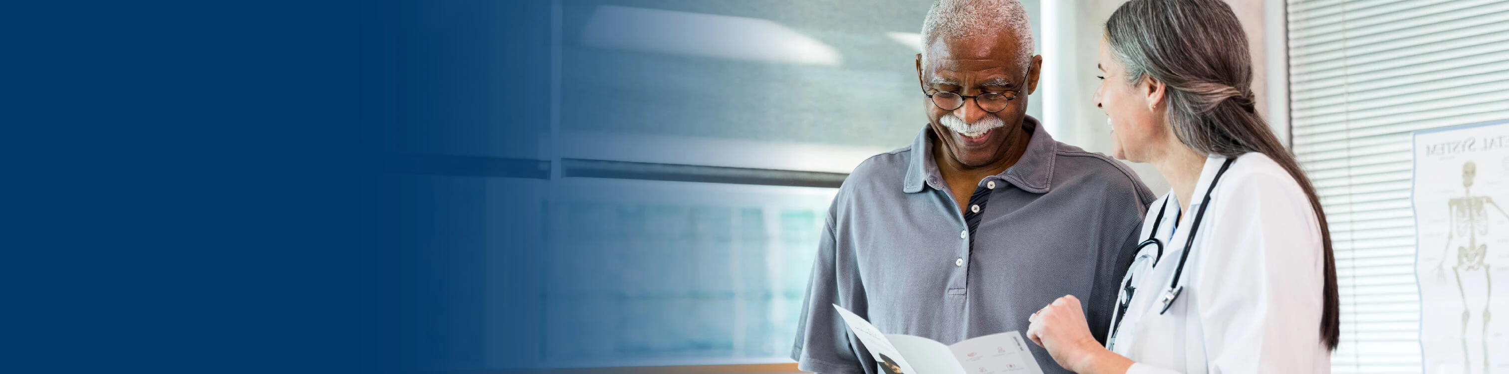 A man talking to his doctor about his records