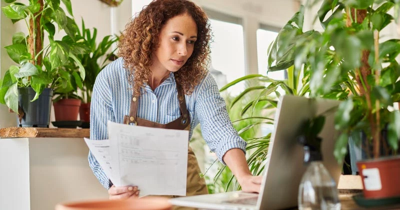 A woman working on sending out invoices
