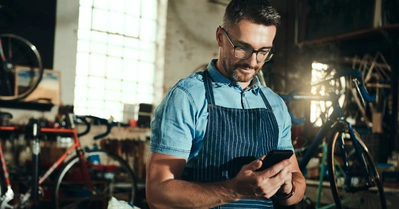 A man checking his online banking via his mobile device