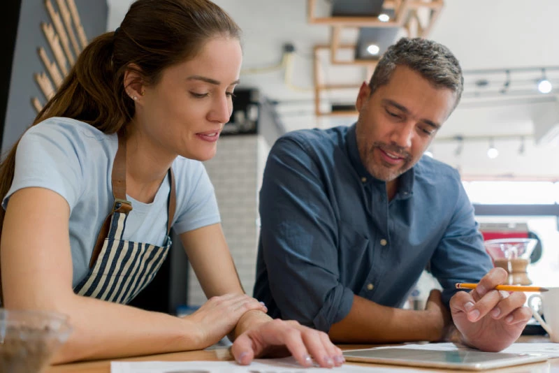 Two people looking at a digital payment solution