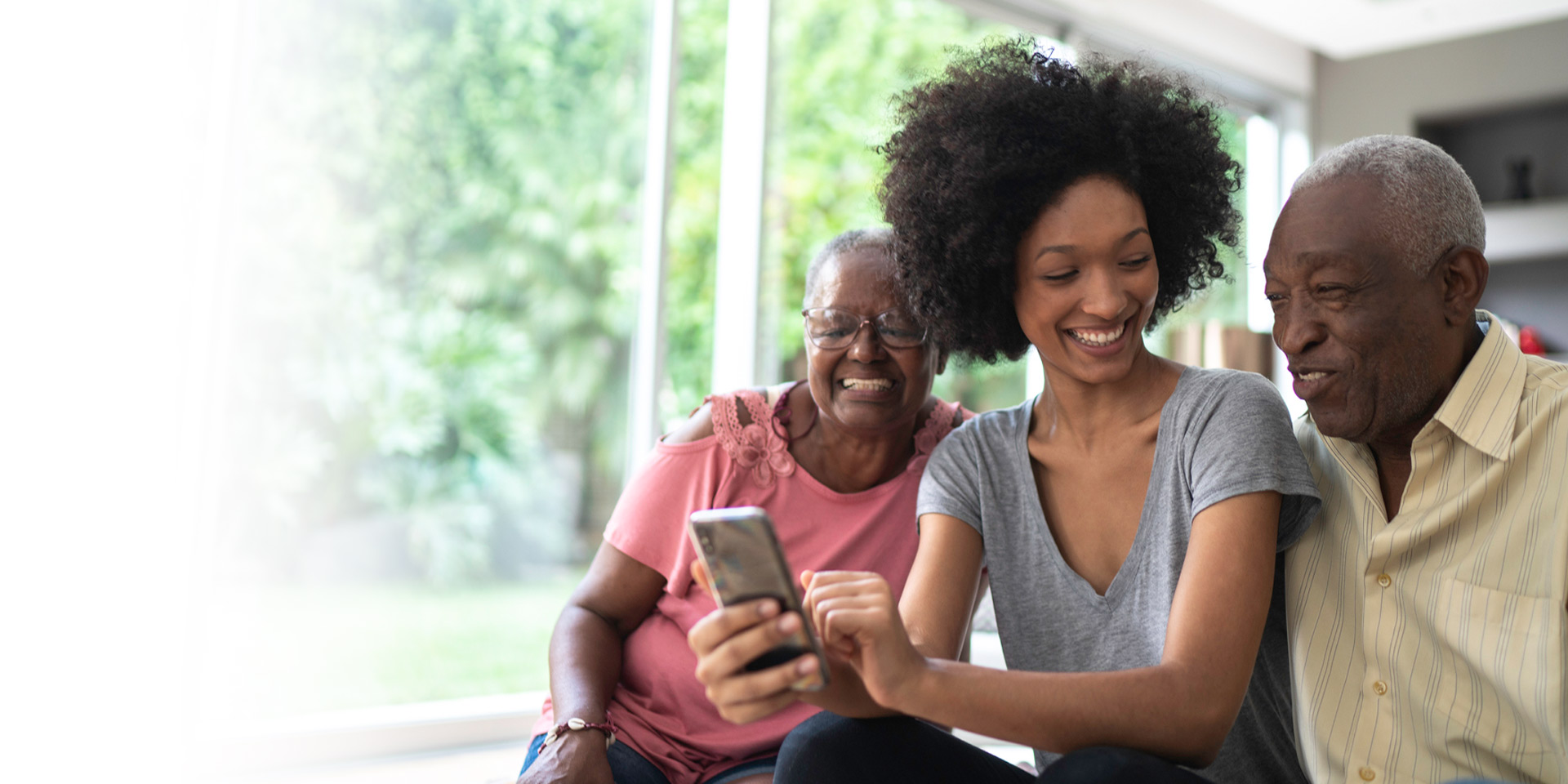 A daughter helping her parents use Zelle