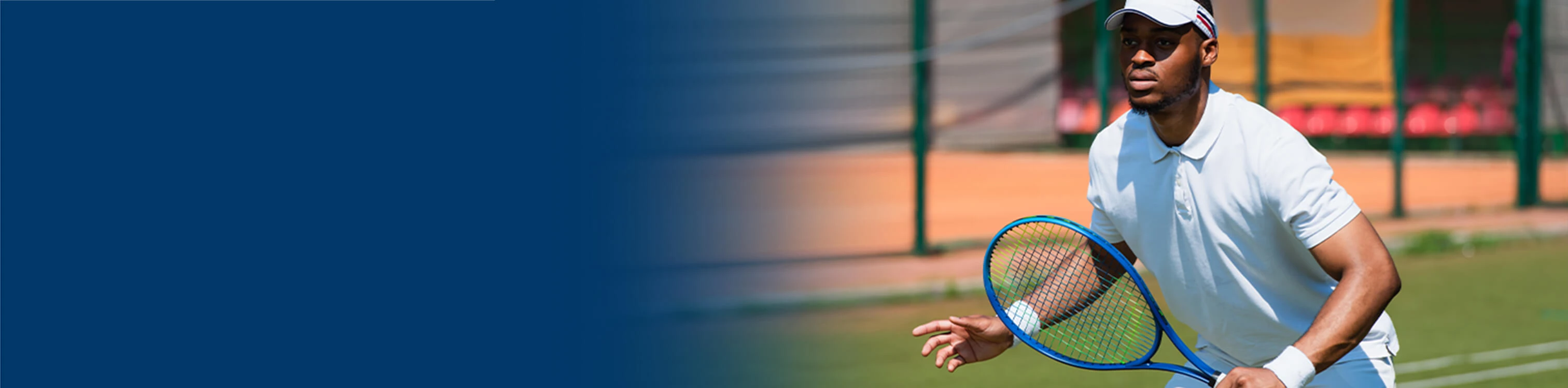 A man outside playing tennis