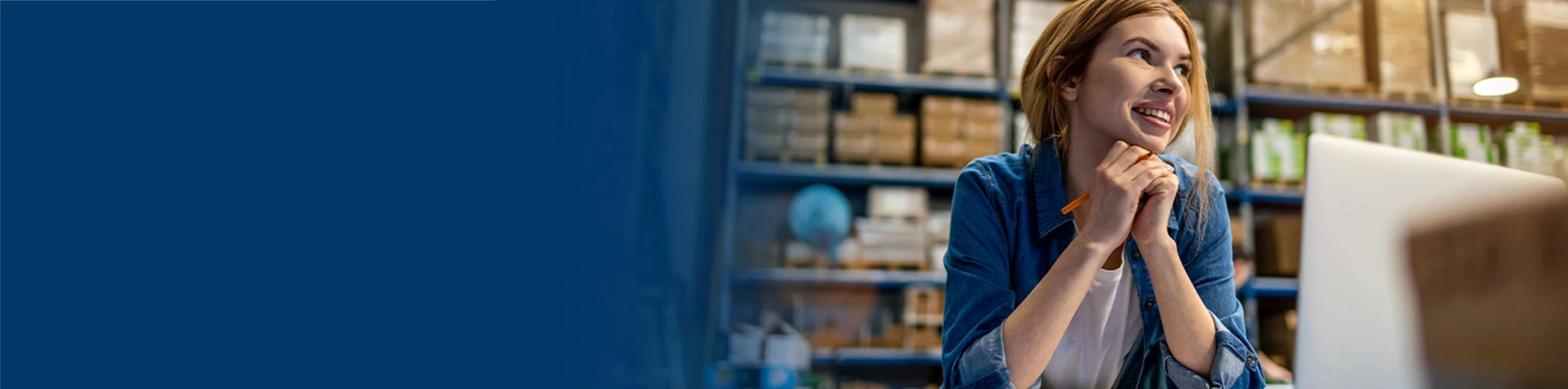A woman working in her warehouse