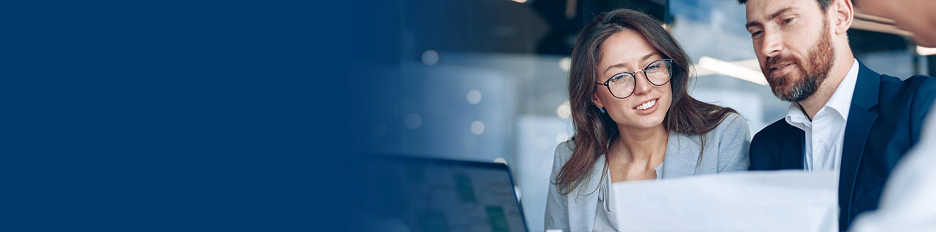 Two associates looking at digital banking