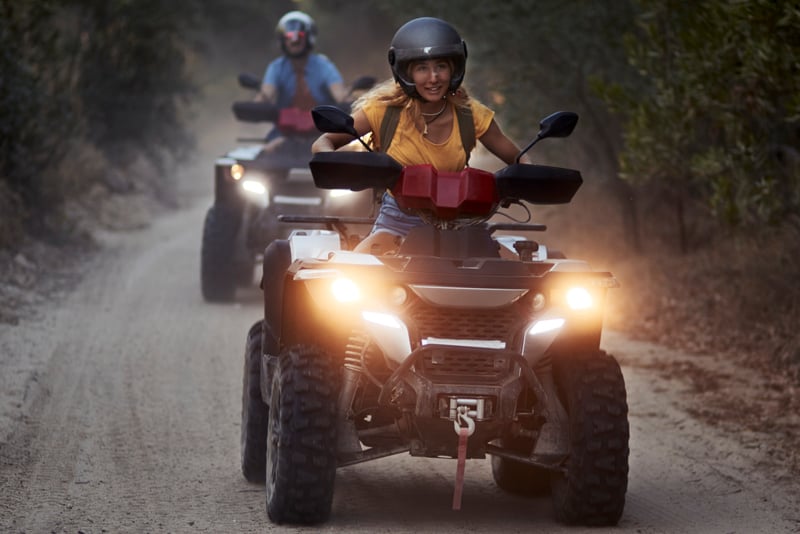 A couple out on a four wheeler ride