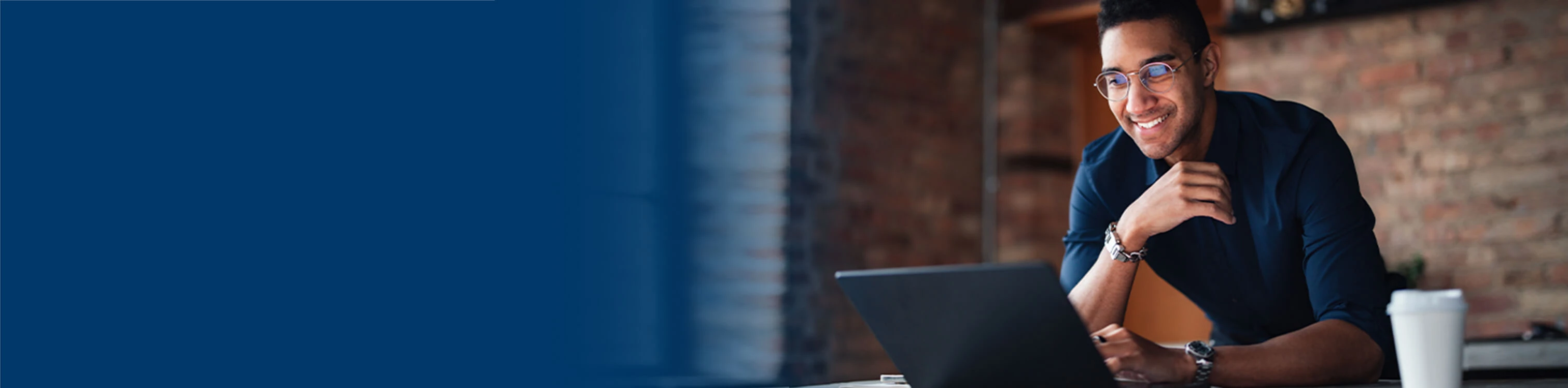 A man on his laptop joining a meeting