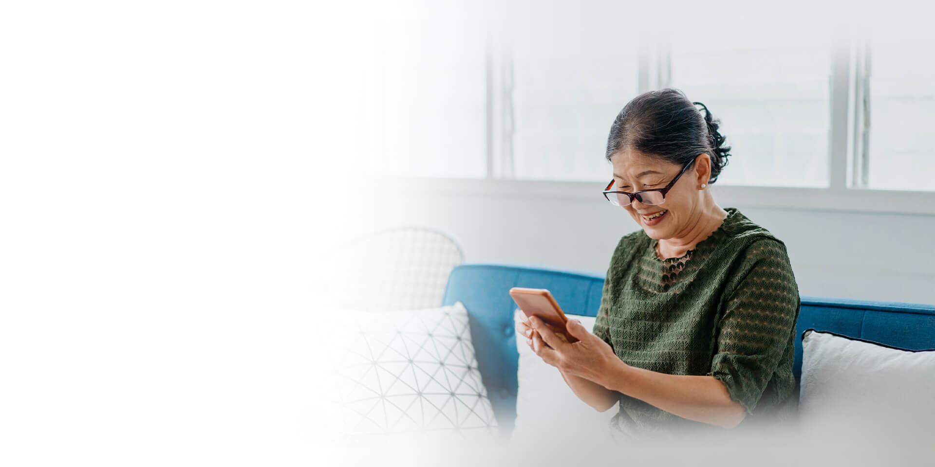 A woman on her mobile device looking at her account