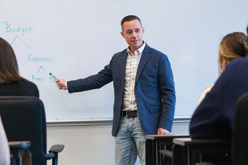 An instructor conducting a workshop in his community