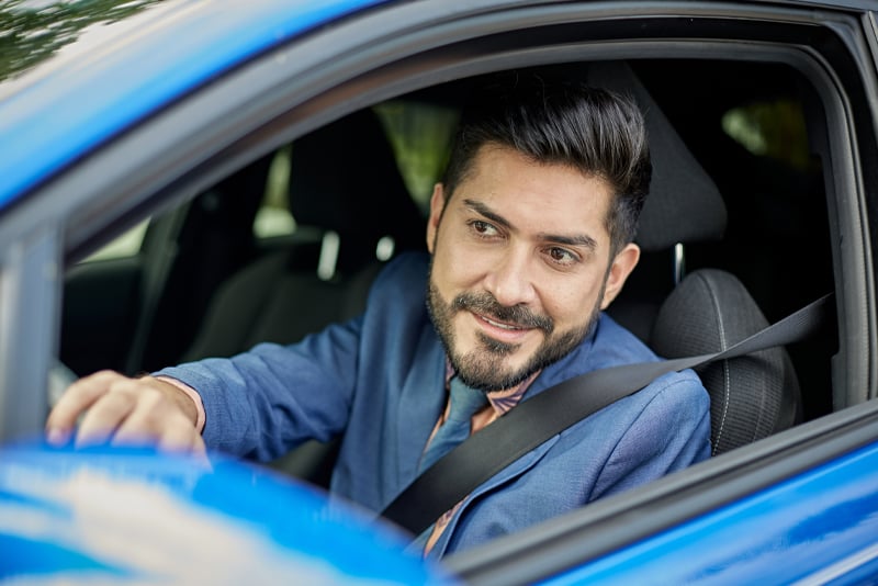 A man driving his car