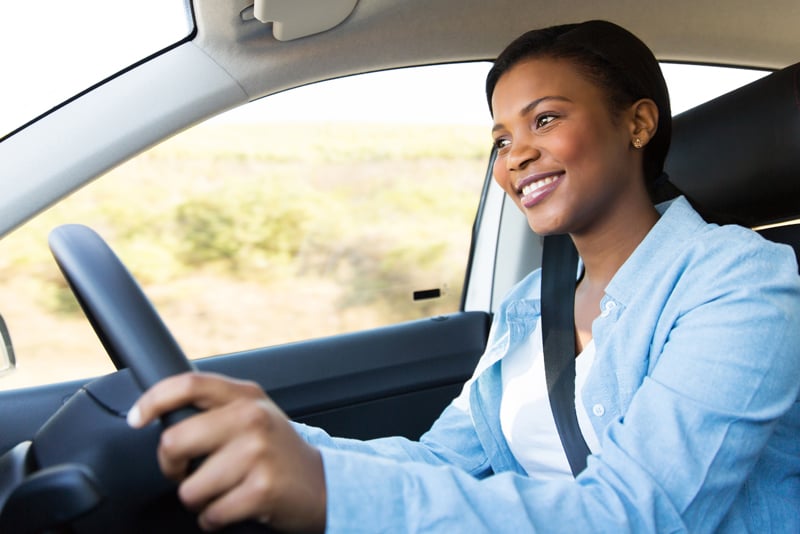 A woman out driving her car