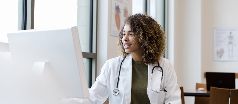 A doctor looking online at her patient data