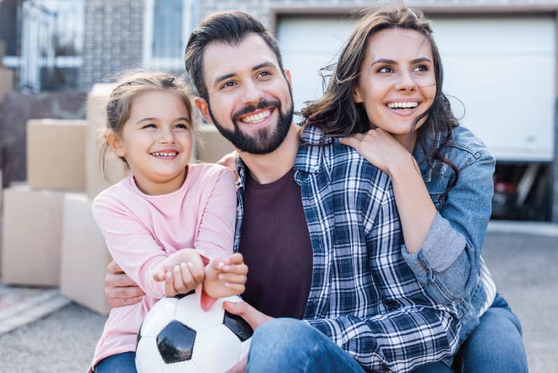 A family moving into their first home