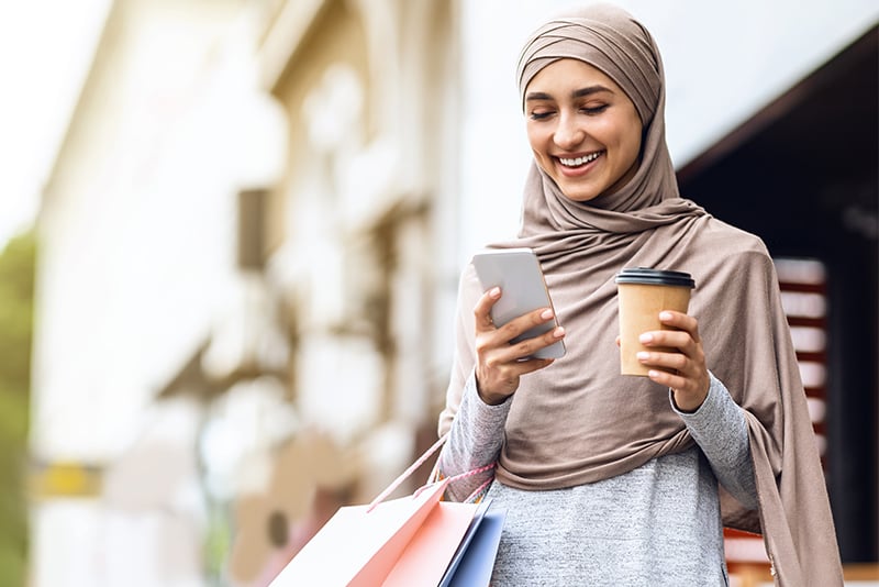 A woman looking at her Online Banking account from her mobile device