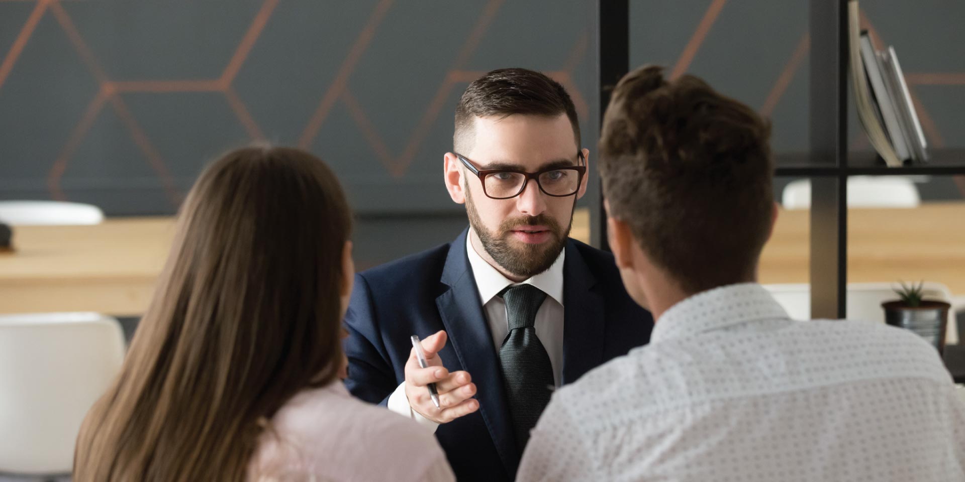 A lender talking to new clients about a loan