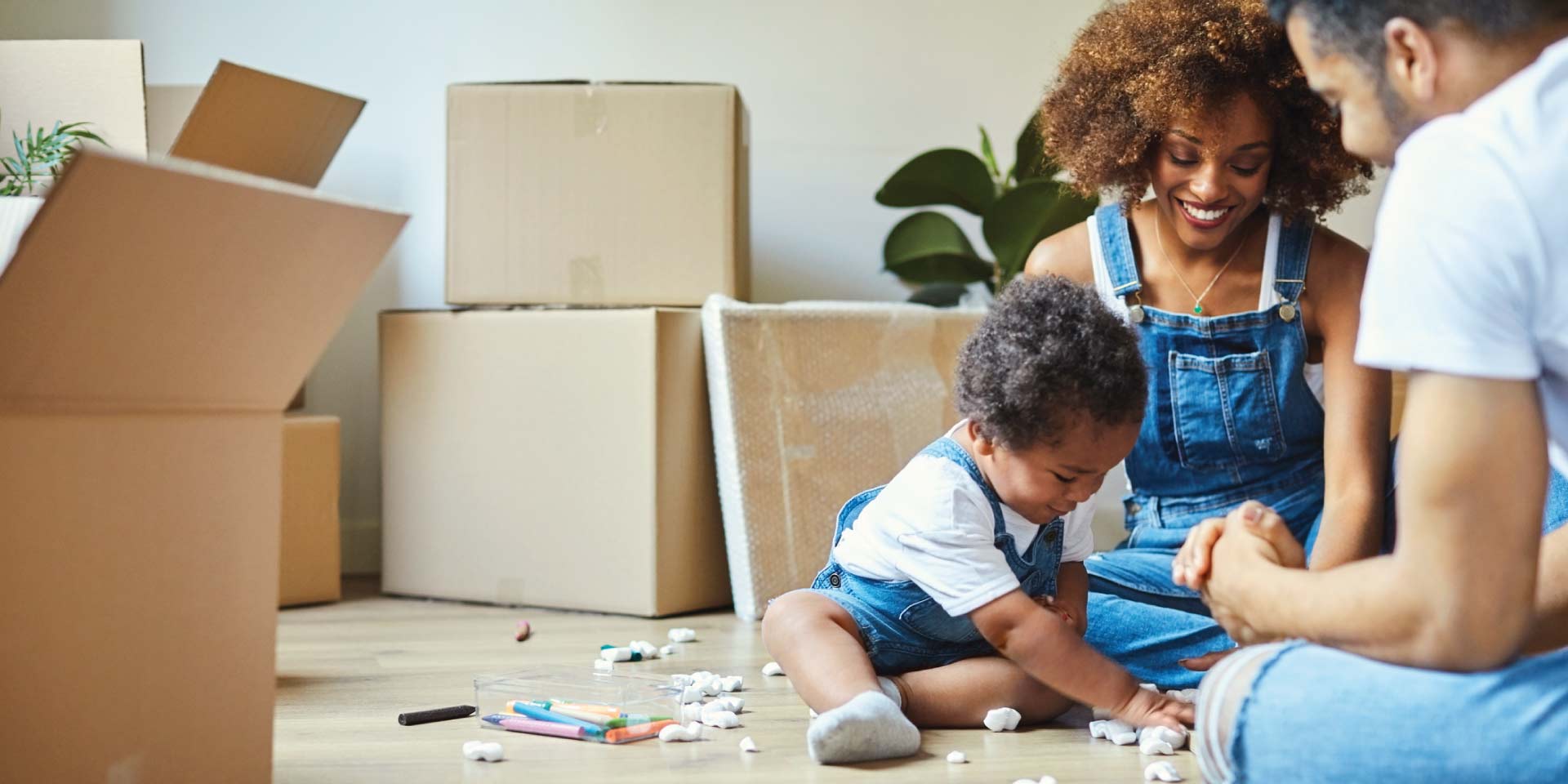 A family playing on their new living room floor