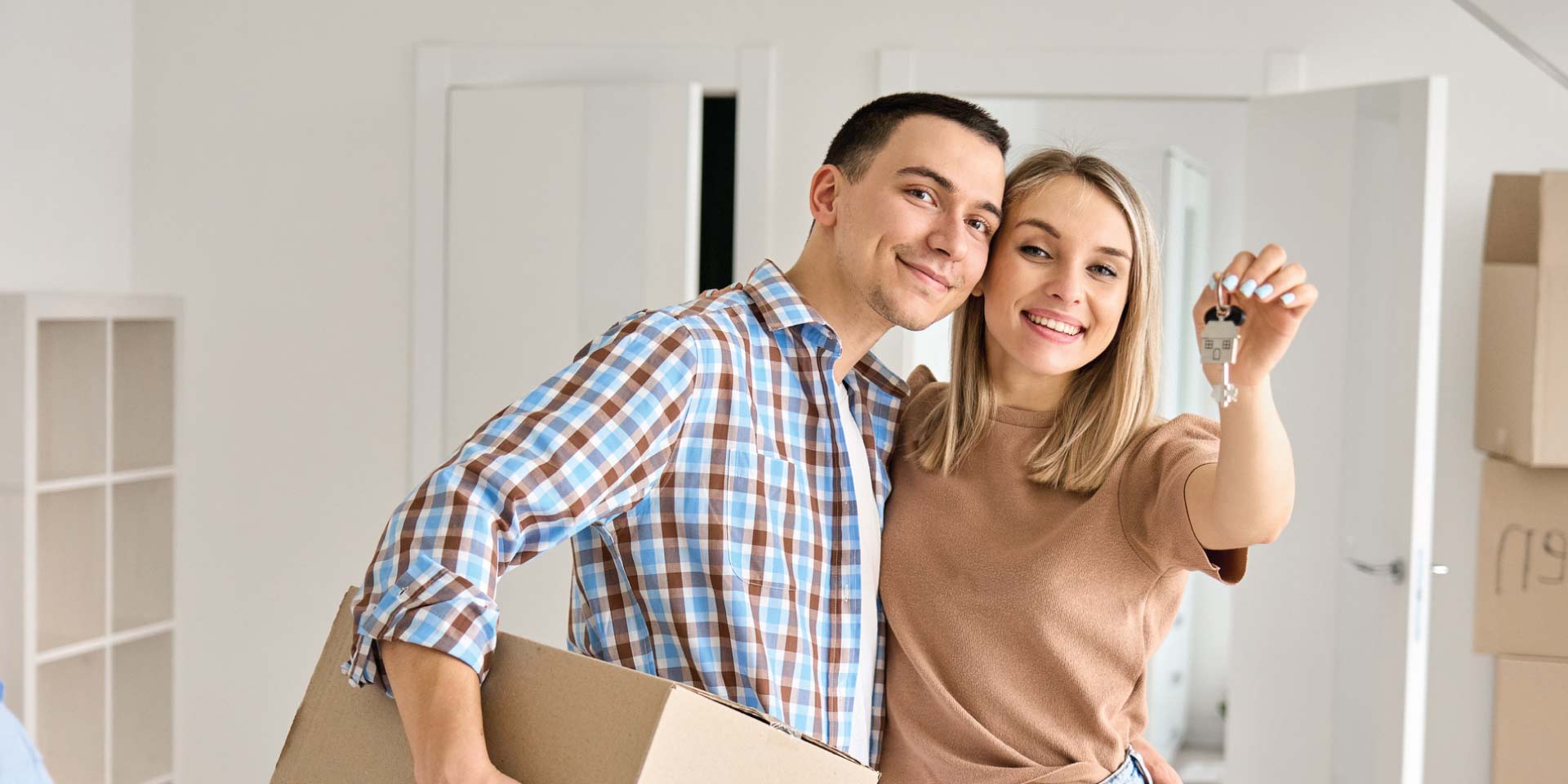 A couple moving into their first home