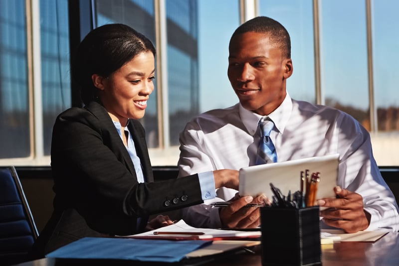 Two bankers working on a project together