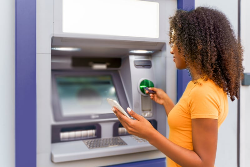 A client getting money out of the ATM